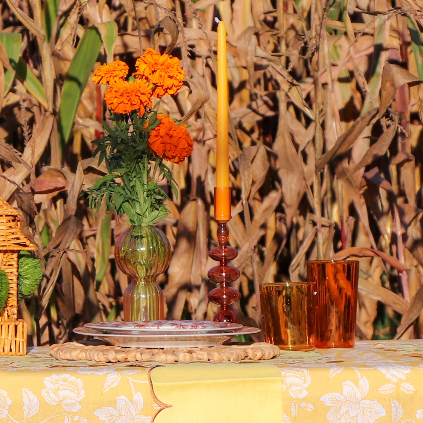 Café Brown Candle Holder - Outside setting with glassware and an orange candle - Ro'Table NYC