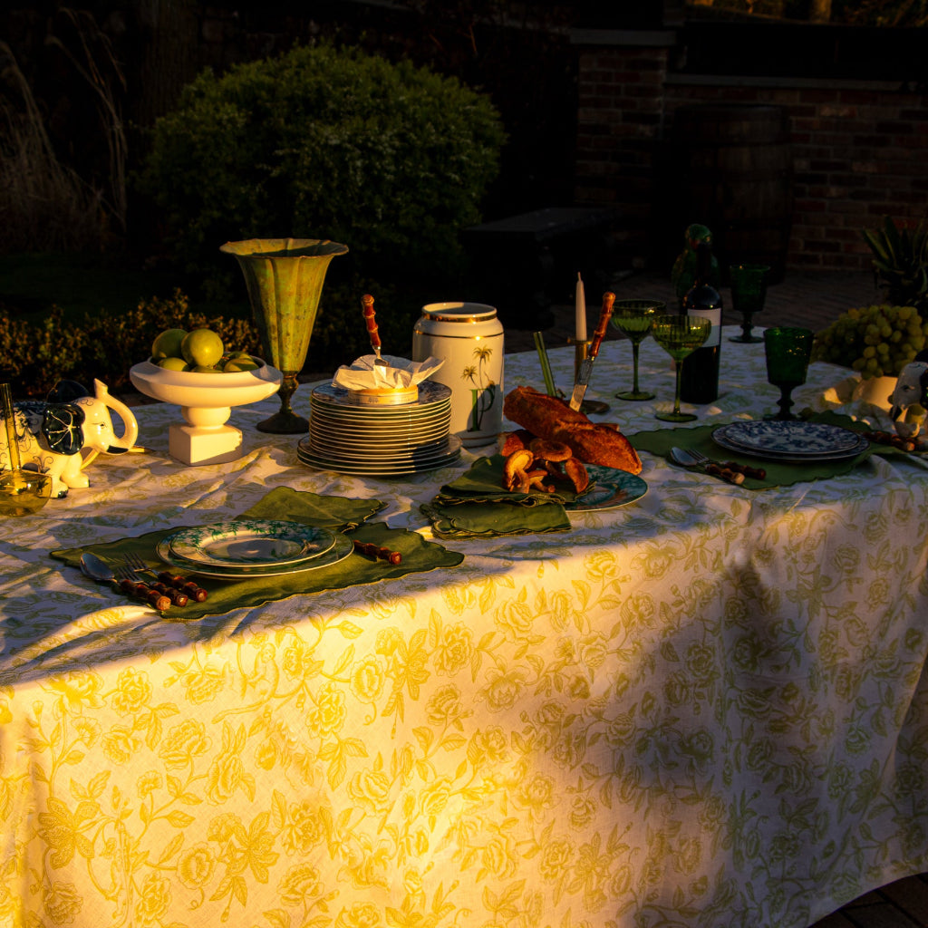 Ivory Flora Parlour Tablecloth in a warm dinner party setting with candles and flowers - Ro'Table NYC