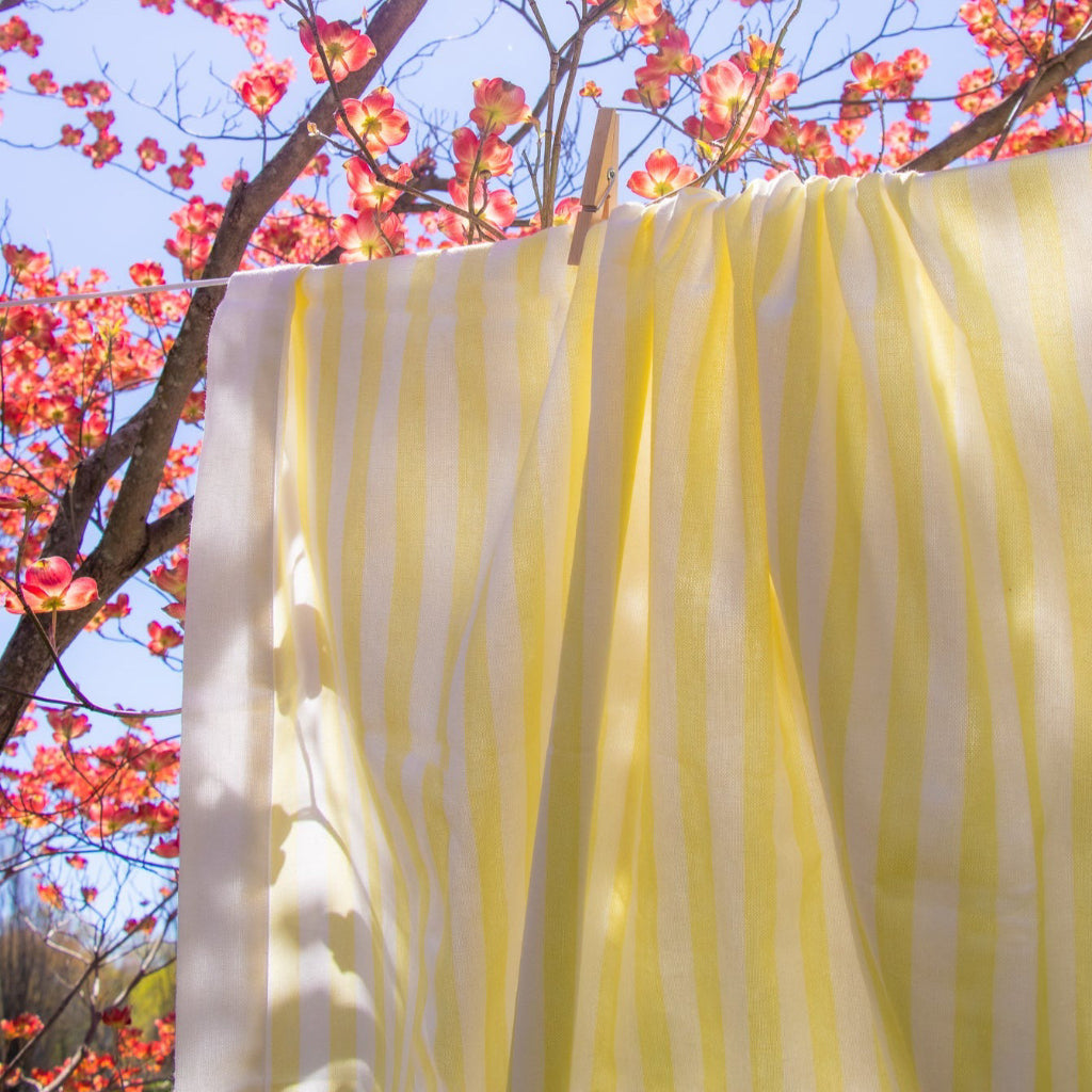 Buttercream Yellow Stripe Tablecloth close-up showing premium linen drape and print - Ro'Table NYC