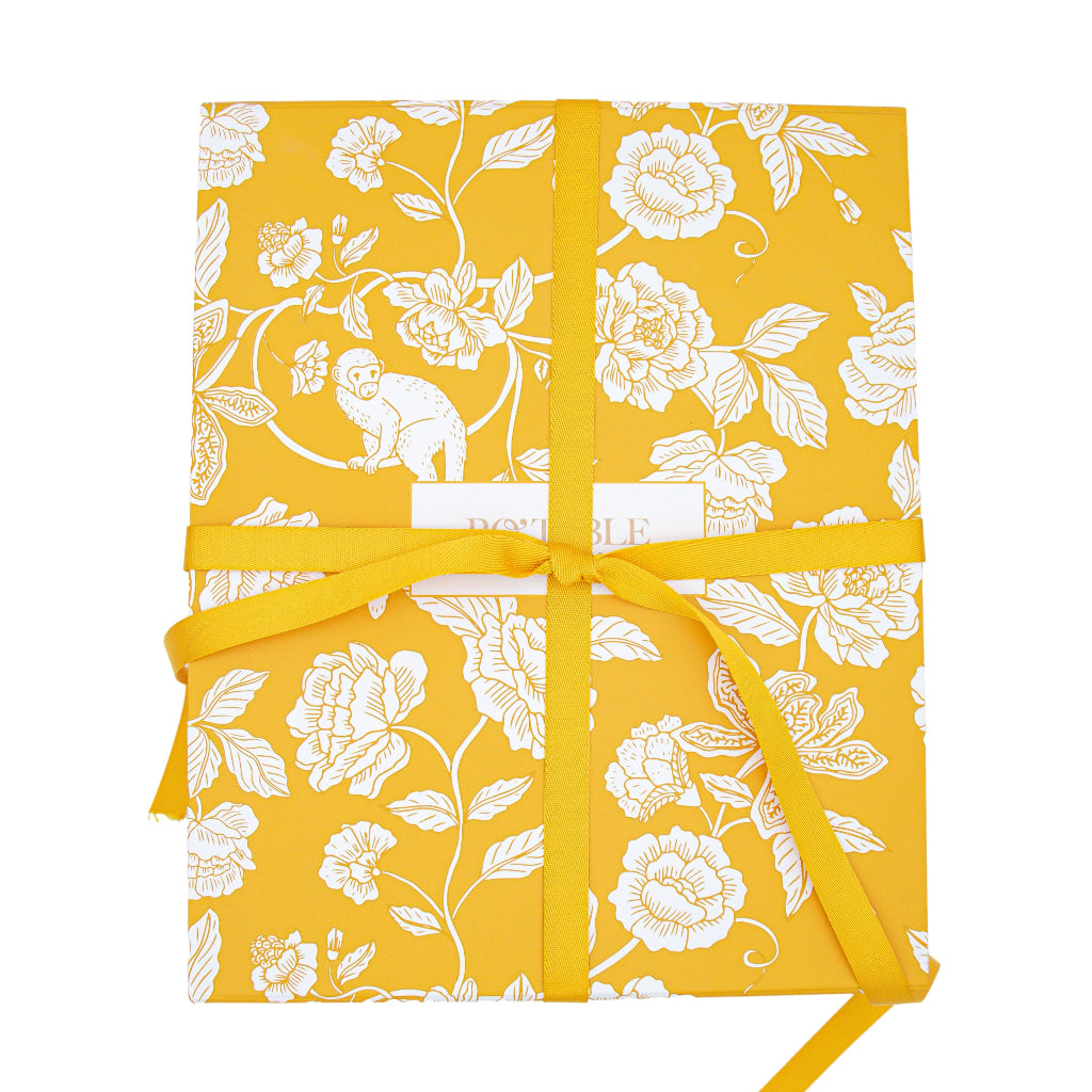 Magnetic Mustard Gift Box - Foldaway in a warm dinner party setting with candles and flowers - Ro'Table NYC