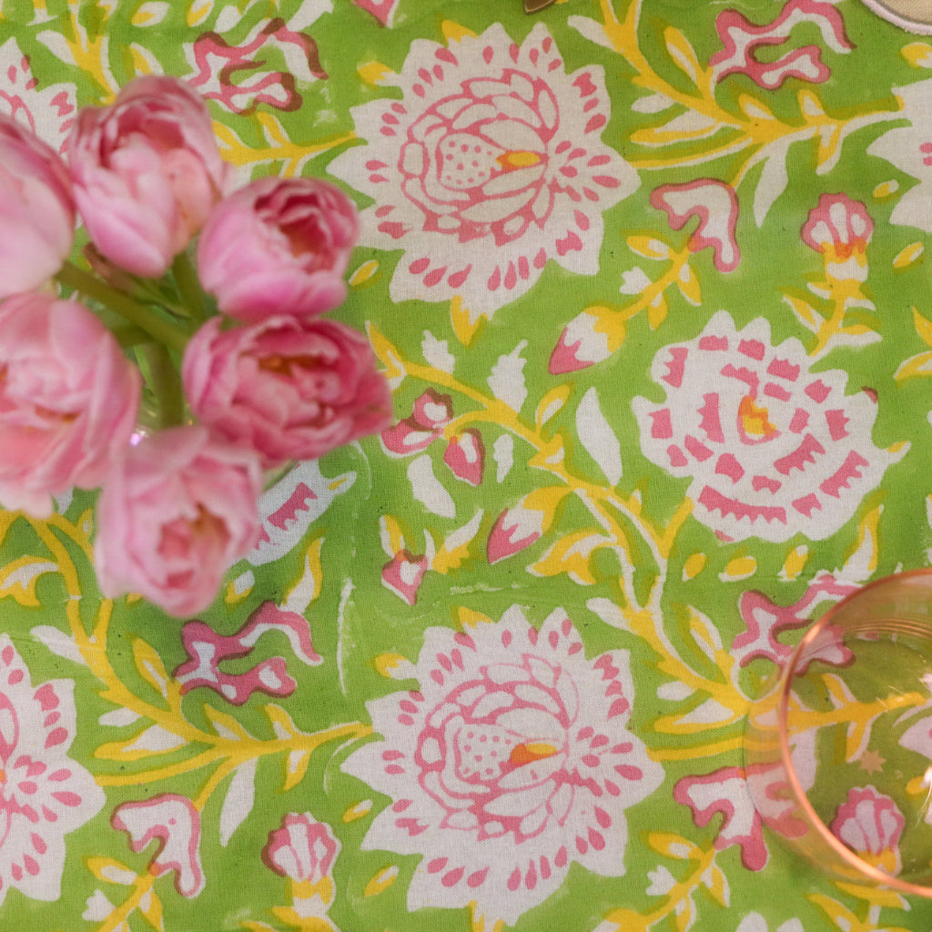 100% Organic Cotton - Viviana Venetia Blooms Tablecloth in a warm dinner party setting with candles and flowers - Ro'Table NYC