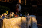 Safari Tablescape White linen featuring a delicate pistachio green design of subtle monkeys and floral patterns