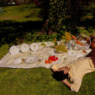 Picnic with Model on Lemon Sherbet Yellow and White Striped Tablecloth in Linen. Hot air ballon plates