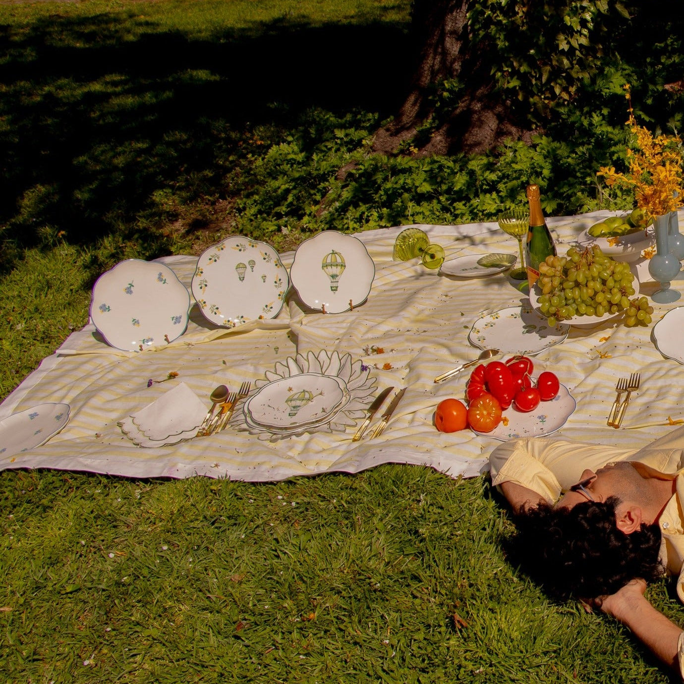 Picnic with Model on Lemon Sherbet Yellow and White Striped Tablecloth in Linen. Hot air ballon plates