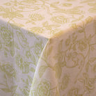 White linen featuring a delicate pistachio green design of subtle monkeys and floral patterns