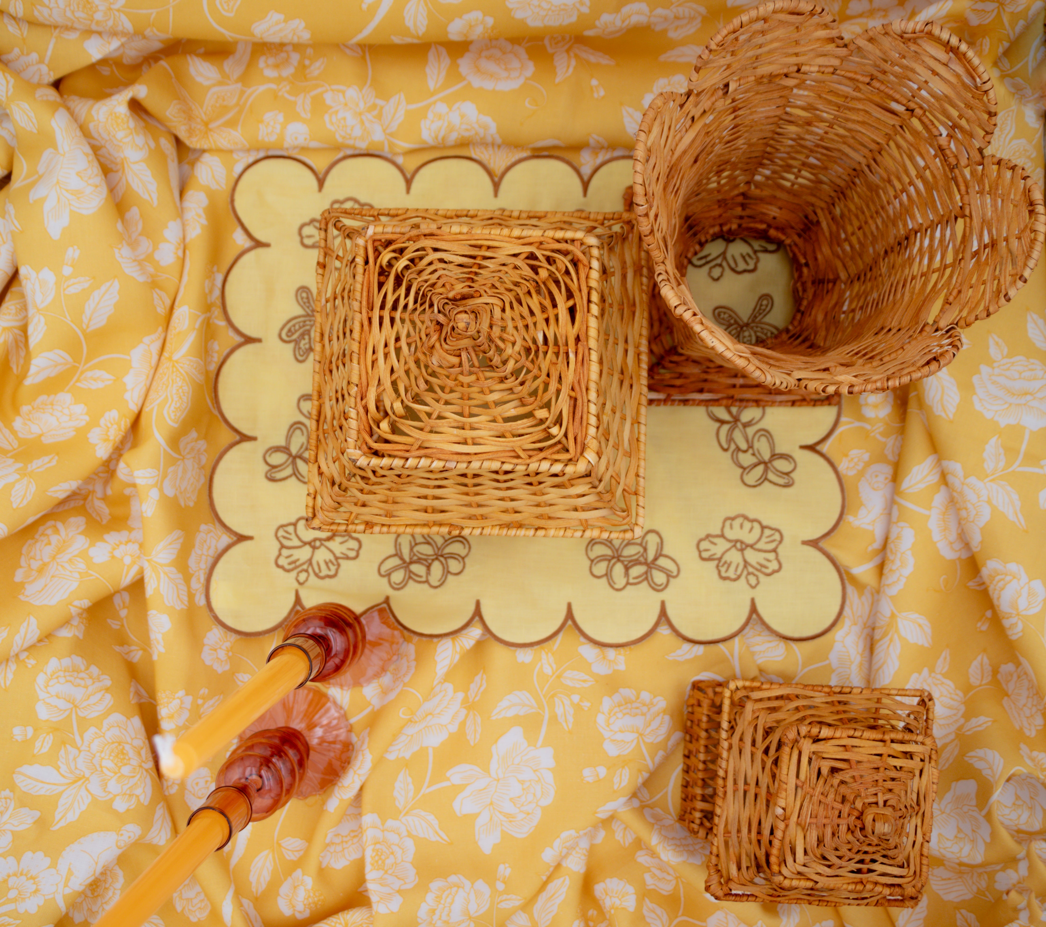 Sun kissed Marigold tableware with rattan and brown edged embroidered scalloped placemat