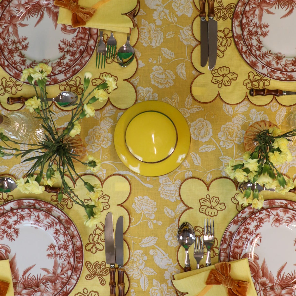 Tablescape in earthy browns with Marigold tablecloth in linen. Hidden monkeys and tigers