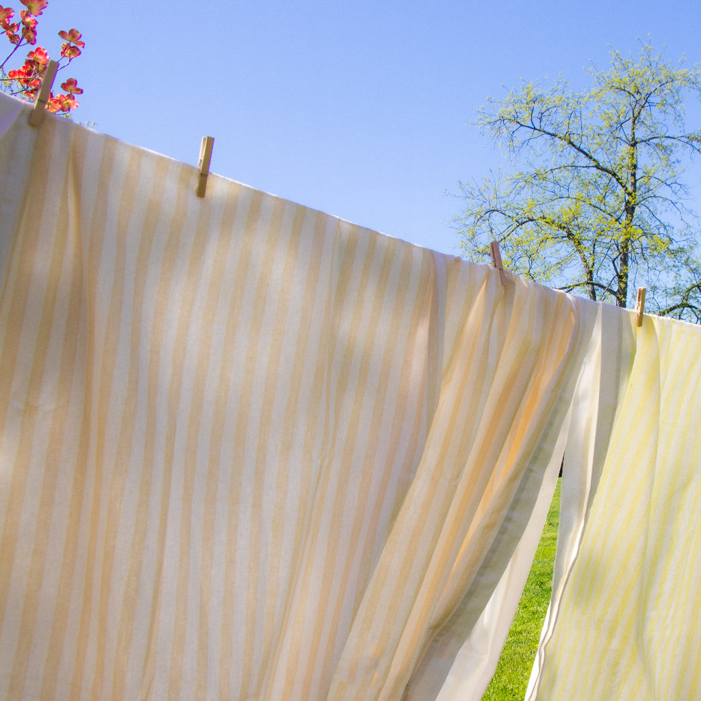 Lychee Sorbet Stripe Tablecloth styled on a luxury dinner table setting - Ro'Table NYC