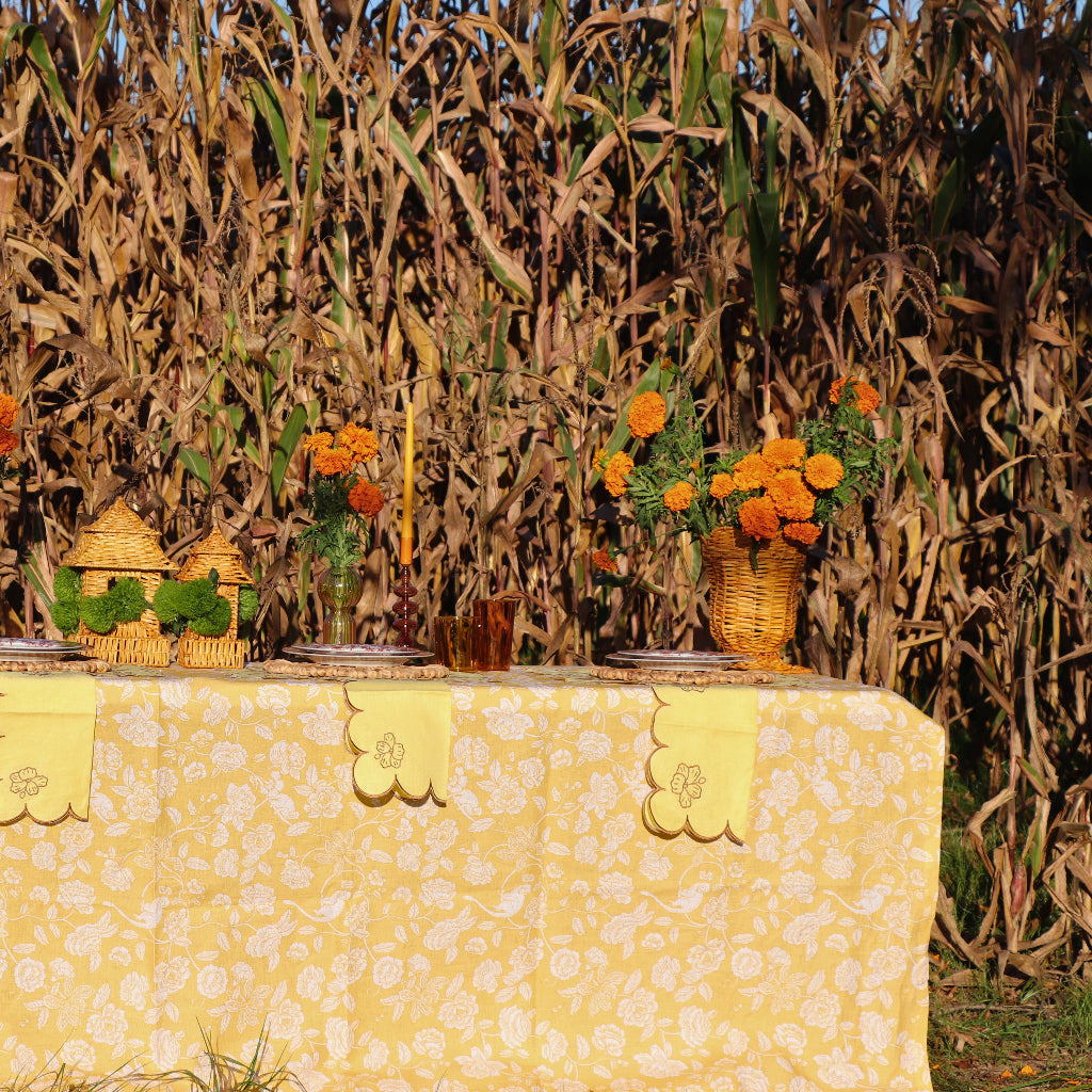 Marigold Flora Parlour Tablecloth in a warm dinner party setting with candles and flowers - Ro'Table NYC