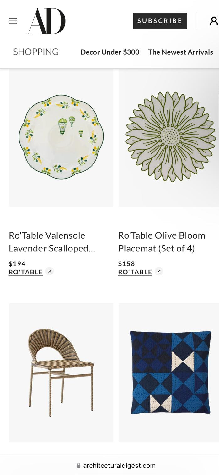 Architectural Digest shopping page featuring Ro'Table NYC Valensole Lavender Scalloped Placemat and Olive Bloom Placemat luxury table linens